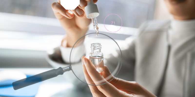 A Person using a dropper from a glass bottle, with magnifying glass and CBD-Glossary graphic overlay.